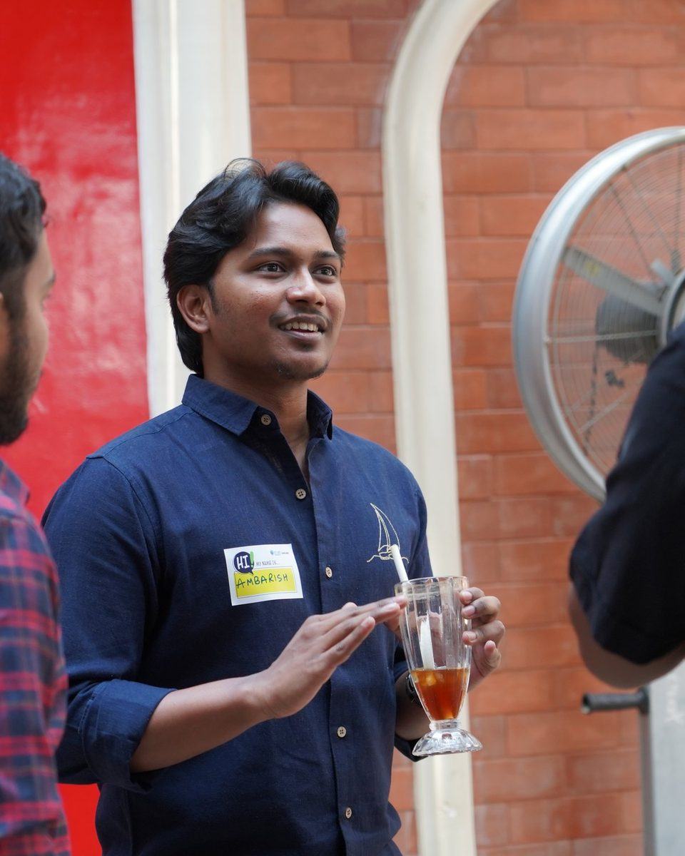 Ambarish Essetty smiling at a meetup in Bengaluru